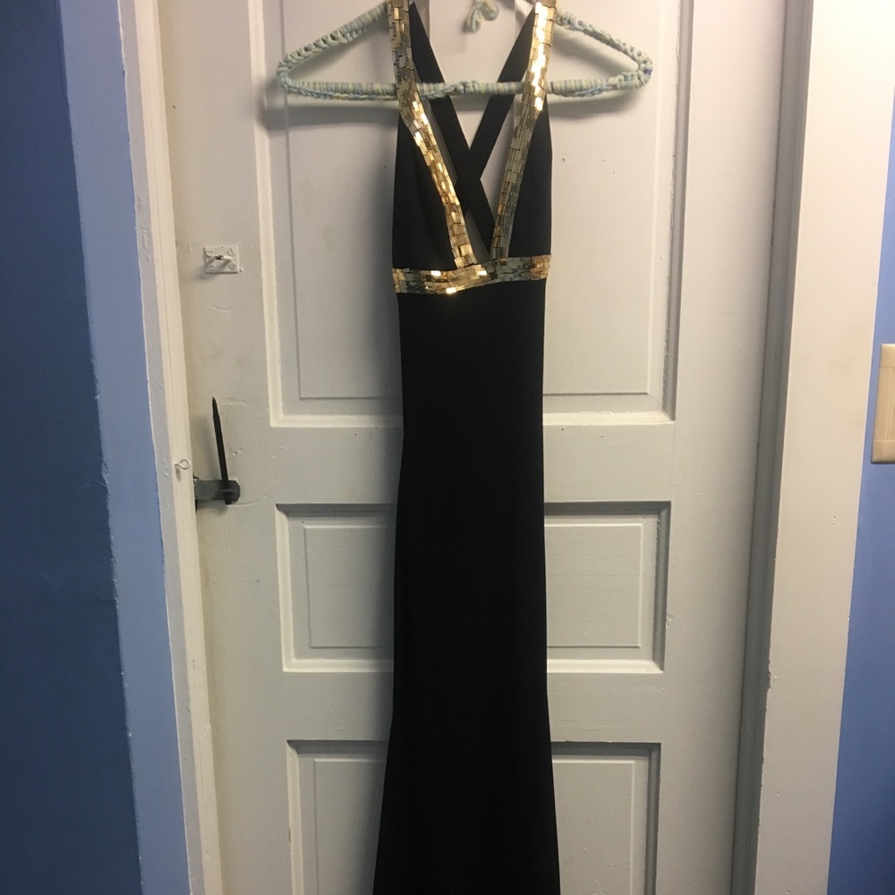 black and gold prom dress with a criss cross back
